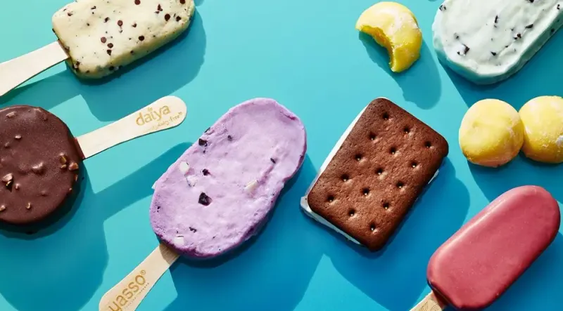 Assorted frozen dessert bars on a blue background