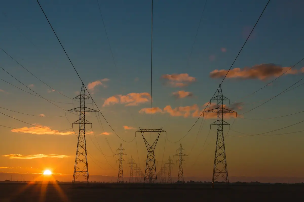 High-voltage power lines at dusk