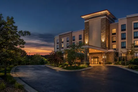 Comfort Suites hotel front entrance and porte-cochère at dusk