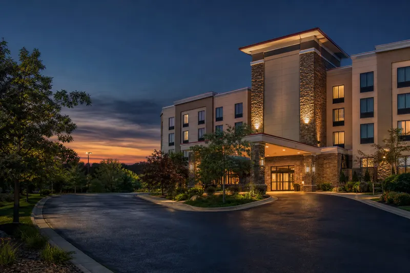 Comfort Suites hotel front entrance and porte-cochère at dusk